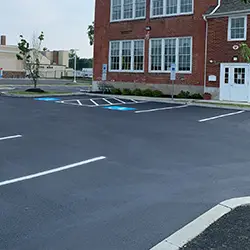 picture of a stripped parking lot after seal coating